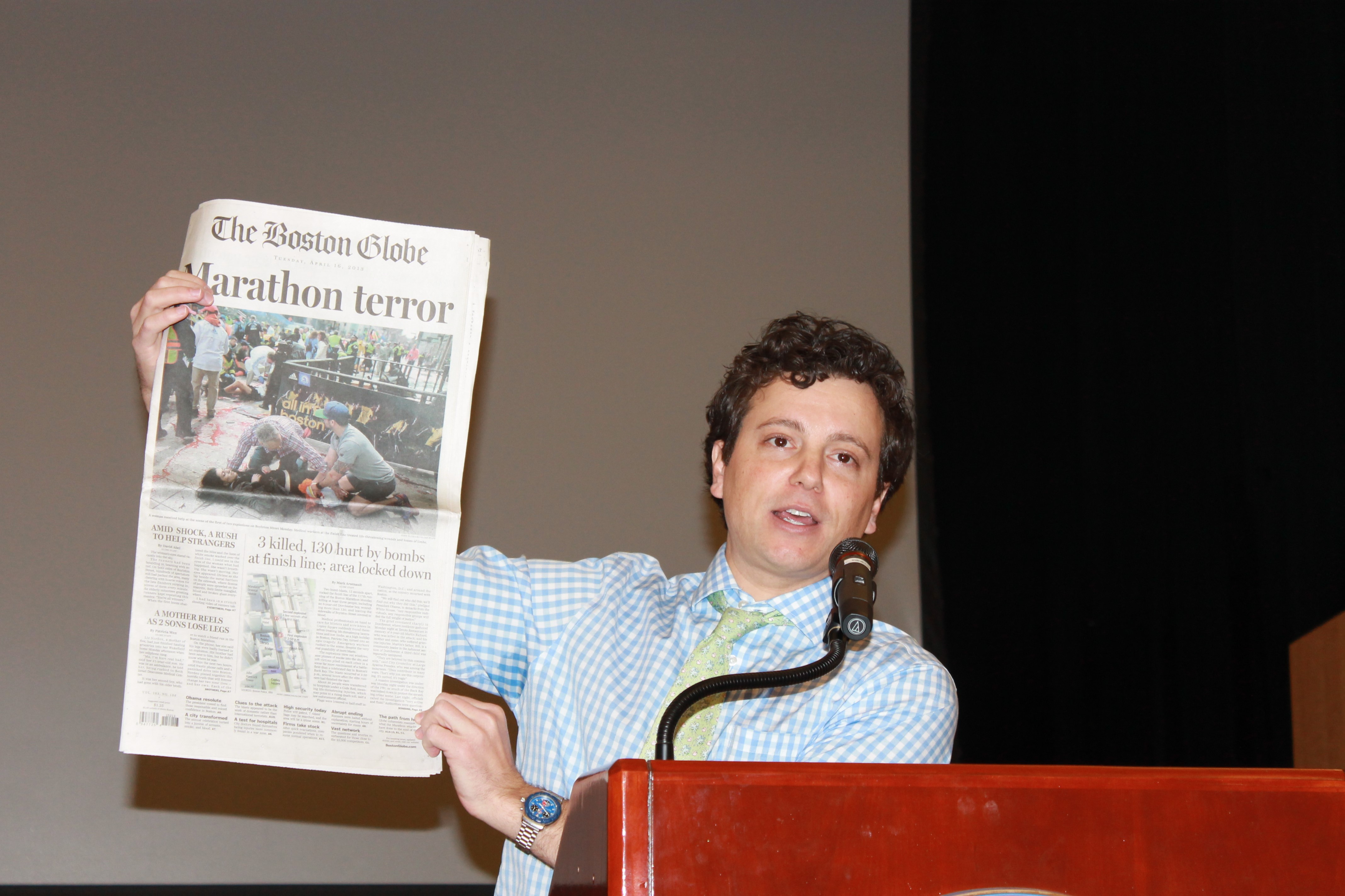 holding newspaper