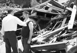 Obama consoles a tornado victim in 2001 in Joplin, Missouri