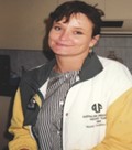 Kathleen wearing her green and gold Australian team tracksuit, in underwater hockey.